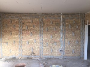 Dot & dab adhesive, plasterboard ready to be stuck