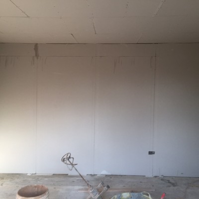 Plasterboard bonded to wall. Dot & dab