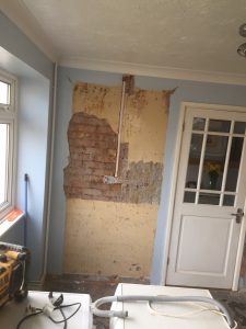 Plaster back to brick