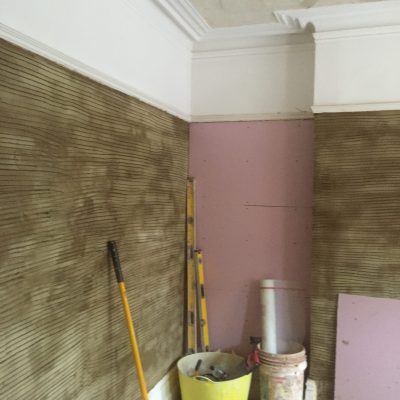 1st coat of plaster in living area