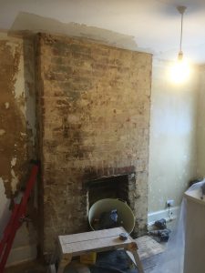 Loose plaster removed prior to Plastering